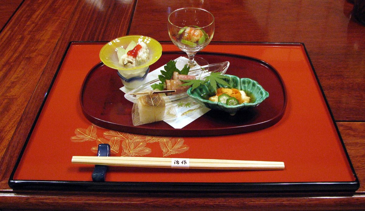 A course from a Japanese kaiseki meal plated on ceramic